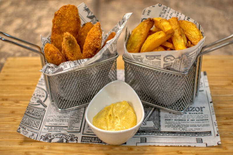 Crispy waffle fries side with seasoning